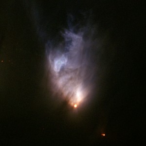 Protostjärnan syns vid nebulosans nedre spets. Foto: Gemini Observatory, 2004