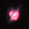 Merging galaxies in the distant Universe through a gravitational